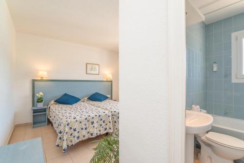 Ένα ή περισσότερα κρεβάτια σε δωμάτιο στο Hotel Platja d'Aro