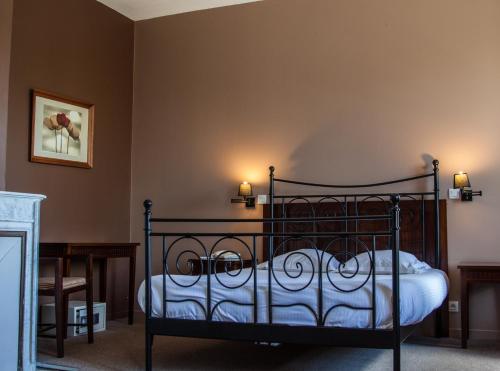 En eller flere senge i et værelse på Domaine du Pont de l'Eyre