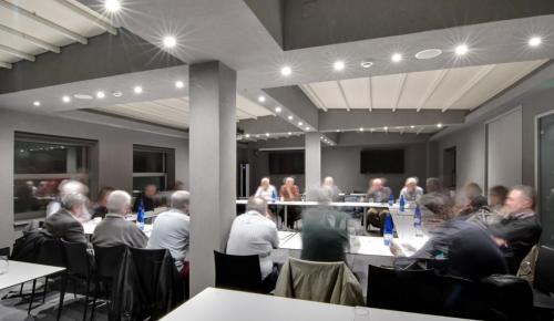 a group of people sitting at tables in a room at Lake Spirit Boutique Hotel & Spa in Ioannina