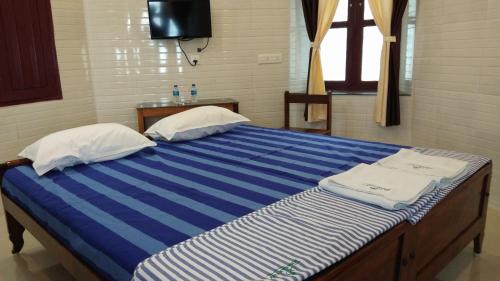 Postel nebo postele na pokoji v ubytování Hotel Jebasakthy