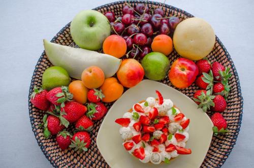 a plate of fruits and vegetables on a table at Lake Spirit Boutique Hotel & Spa in Ioannina