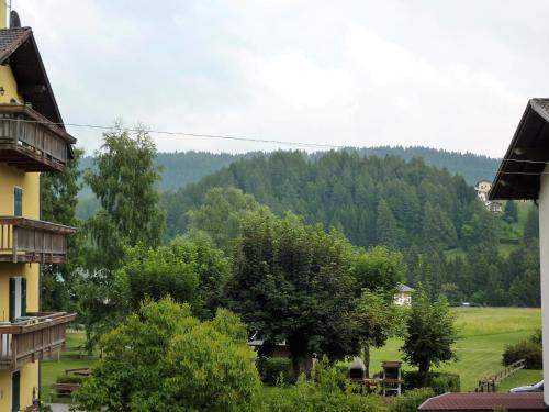 a view of a valley with trees and a mountain at Trentino Apartments - Casa ai Tolleri in Folgaria