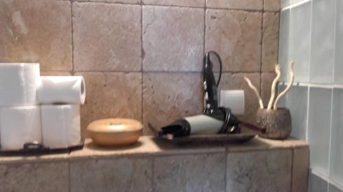 a kitchen counter with paper towels and a phone on it at ILE SAINT-LOUIS GLAMOROUS FLAT in Paris