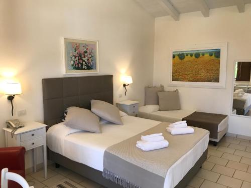 Postel nebo postele na pokoji v ubytování Relais Masseria Serritella
