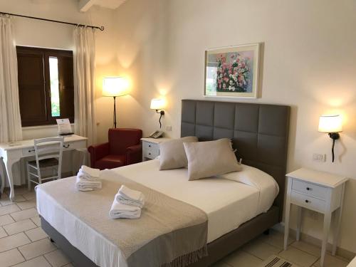 Katil atau katil-katil dalam bilik di Relais Masseria Serritella