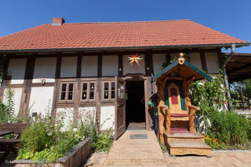 a small house with a star on the roof at Mobile-Home in Fürstenberg-Havel