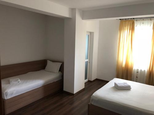 Ένα ή περισσότερα κρεβάτια σε δωμάτιο στο Hotel Nova Residence