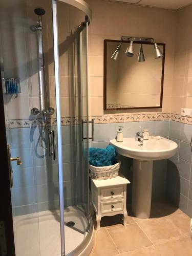 a bathroom with a shower and a sink at Apartamento Canela in Ayamonte