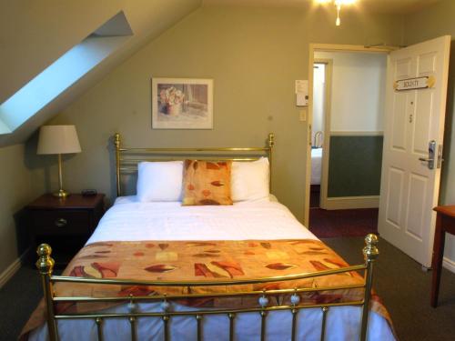 a bedroom with a bed in a room at Brigantine Inn in Lunenburg