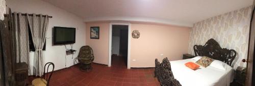 TV a/nebo společenská místnost v ubytování Finca La bella