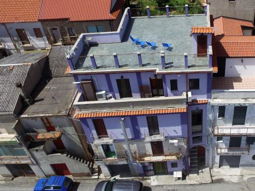 an overhead view of a purple building with cars parked outside at B&B L'Alba in Gagliato