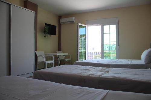 Säng eller sängar i ett rum på Hotel Eduard