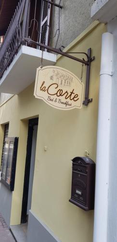a sign on the side of a building with a stove at La Corte B&B in Candiolo
