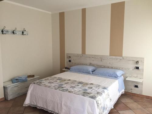 Postel nebo postele na pokoji v ubytování B&B sotto le mura