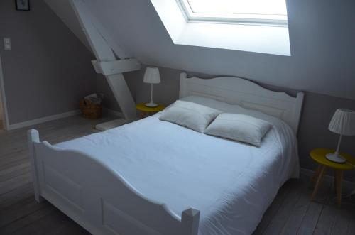 Postel nebo postele na pokoji v ubytování Gîte du Frêne