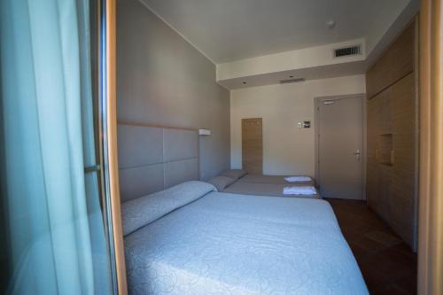 Katil atau katil-katil dalam bilik di Hotel Miramare
