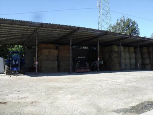 a large barn with hay bales in it at B&B Podere Montese in Villafranca in Lunigiana