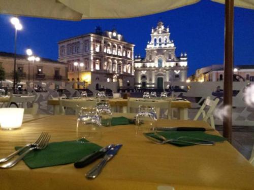 a table with fork and knife on top of a building at Casa vacanza Contry House Romantic in Grammichele