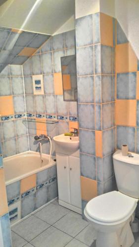 a bathroom with a toilet and a sink at Apartament w Giżycku przy plaży in Giżycko