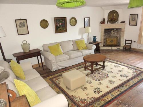 a living room with a couch and a table at Lemoniegites in Lemonie