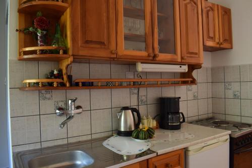a kitchen with a sink and a counter top at Bisha Apartments in Ulcinj