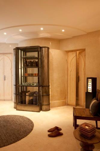 a living room with a couch and a wine cellar at Riad Dar Maya in Essaouira
