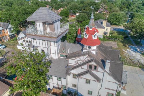 an aerial view of a house with a red roof at Houston Towers Inn, Adults-Only, Downtown, Med Ctr, NRG in Houston