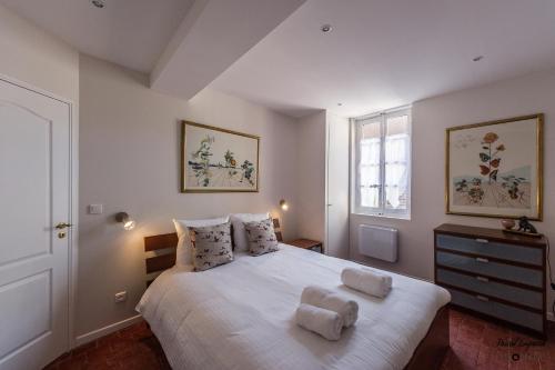 Säng eller sängar i ett rum på 12 Carnot - Beaune