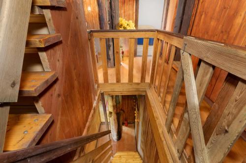 an overhead view of a staircase in a wooden house at Windmill vacation home in Ledzin near Baltic Sea in Niechorze