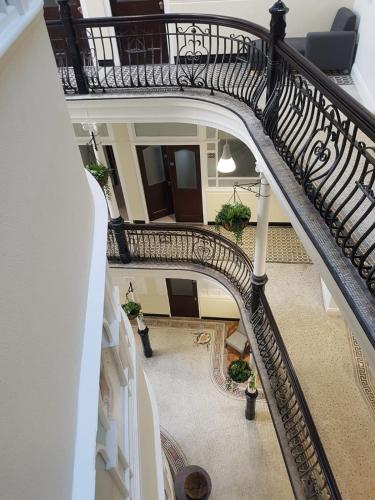 an overhead view of a spiral staircase in a building at Terlon Apartments in Liverpool