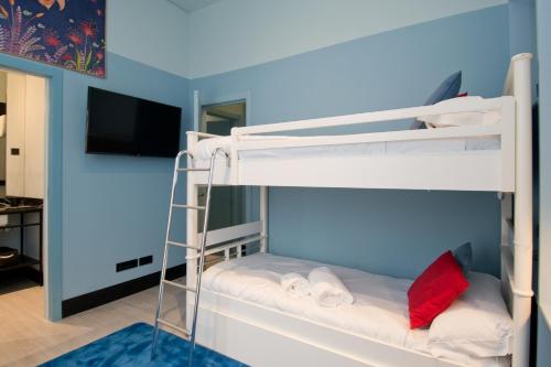 Łóżko lub łóżka w pokoju w obiekcie Amor de Dios 17 Boutique Apartments