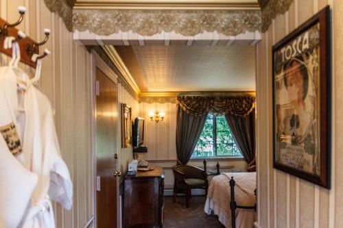 a hotel room with a bed and a window at Frisco Lodge in Frisco