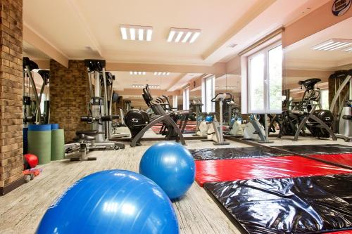 a gym with exercise balls and exercise bikes at Balneo Complex & Spa Aquatonik in Velingrad