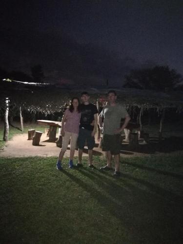 a group of people standing in a park at night at Hidden Jungle Village in Wilpattu