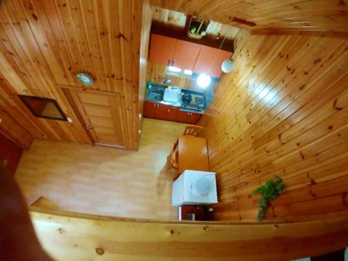 an overhead view of a wooden room with a kitchen at Nadeuri Pension in Pyeongchang 