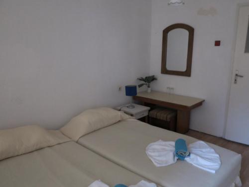 Cama ou camas em um quarto em Hotel Tango