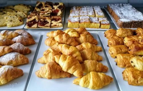 a display of various pastries and breads in a bakery at Guesthouse Verona in Verona