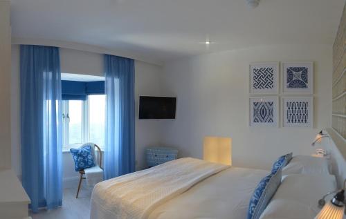 Postel nebo postele na pokoji v ubytování Trevose Harbour House