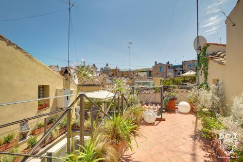 an apartment with a balcony with plants at Residenza Spada in Rome