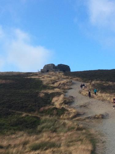 a group of people walking down a dirt road at Granary at Tyddyn Isaf in Ruthin
