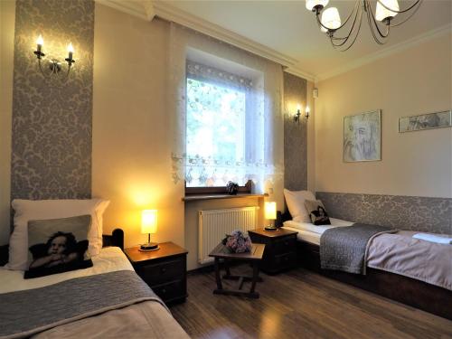 Posteľ alebo postele v izbe v ubytovaní VIP Apartamenty Tetmajera Centrum 2