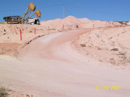 a dirt road in the middle of a desert at Underground Gem in Coober Pedy