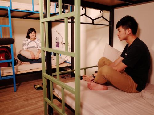 Postel nebo postele na pokoji v ubytování 旅悅 國際青年旅館 DreamWell Hostel