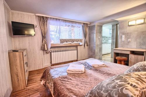 Una cama o camas en una habitación de Willa ZAKObystra