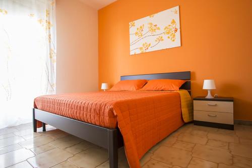 Ένα ή περισσότερα κρεβάτια σε δωμάτιο στο B&B Terra Nobile - Portopalo