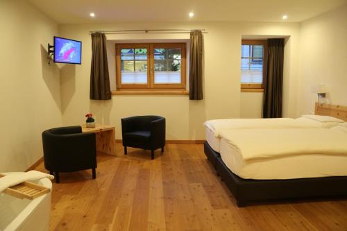 Postel nebo postele na pokoji v ubytování Hotel Helvetia