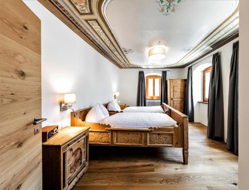 Ένα ή περισσότερα κρεβάτια σε δωμάτιο στο Hotel Münsterhof