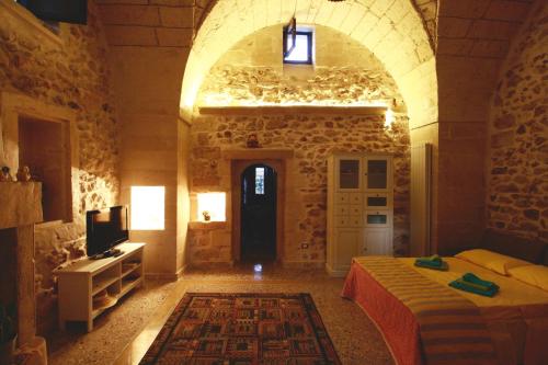 A bed or beds in a room at Dimora Storica San Giovanni
