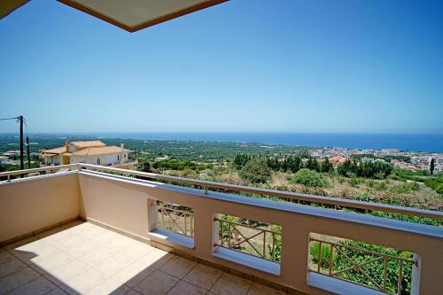 a balcony with a view of the ocean at Villa Myrto in Kyparissia