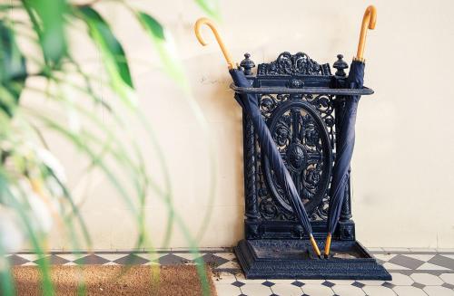 a black shrine sitting on a floor next to a wall at Goble Palms Guest Lodge & Urban Retreat in Durban